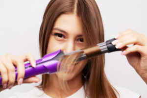 girl curling her hair