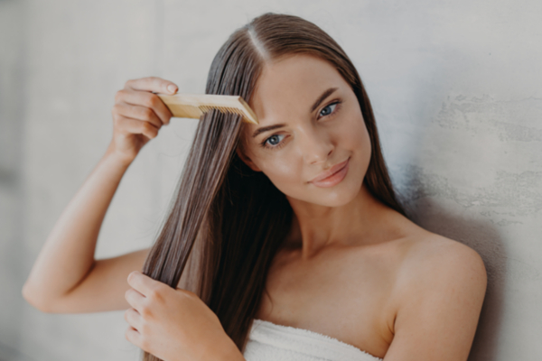 woman applying a hair mask